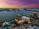 Scenic aerial view of waterfront condos, a marina, and cityscape in the distance at 479 E Shore Dr # 5, Clearwater, FL 33767