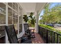 Inviting front porch featuring classic rocking chairs and stylish decor, perfect for relaxing outdoors at 7309 S Shamrock Rd, Tampa, FL 33616