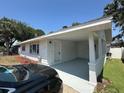 Inviting home featuring a covered parking area and a freshly painted exterior at 7631 43Rd St N, Pinellas Park, FL 33781