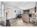 Bright living room with plank floors, barn door accent, and comfortable seating at 7850 40Th N Ave # 7850, St Petersburg, FL 33709