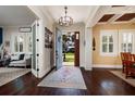 Elegant foyer featuring hardwood floors, an open doorway, and a view of the well-manicured front yard at 852 Cordova Ne Blvd, St Petersburg, FL 33704