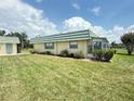 A charming condo with lovely landscaping is surrounded by green grass at 102 Cambridge Trl # 230, Sun City Center, FL 33573