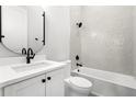 Modern bathroom with white subway tile, black hardware, and elegant fixtures at 218 Hesperides N St, Tampa, FL 33609