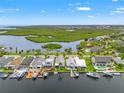 Aerial view of waterfront homes, canals, and boat docks, showcasing the community at 4012 Marine Pkwy, New Port Richey, FL 34652