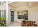Charming front entrance featuring a decorative door and well-maintained landscaping for a welcoming feel at 404 Laurel Lake Dr # 101, Venice, FL 34292