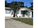 Exterior shot of well-maintained home with manicured lawn and newly mulched front yard at 4511 Hampshire Rd, Tampa, FL 33634