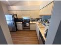Functional kitchen featuring stainless steel appliances and ample cabinet space for storage at 4558 Morningside # 43, Sarasota, FL 34235