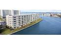 Daytime view of waterfront condo building offering beautiful bay views at 6075 Shore S Blvd # 215, Gulfport, FL 33707