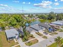 Waterfront single-Gathering home with mature trees and long driveway in a neighborhood setting at 6741 51St N Way, Pinellas Park, FL 33781