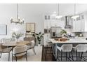 Bright, modern kitchen featuring stainless steel appliances, white cabinets, and a center island with seating at 820 2Nd N Ave, St Petersburg, FL 33701