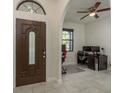 Inviting foyer with elegant front door and tiled floor, leading to a functional office space at 8523 N Newport Ave, Tampa, FL 33604