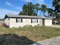 Inviting single-story home with manicured lawn, offering curb appeal and a welcoming entrance at 8665 55Th N St, Pinellas Park, FL 33782