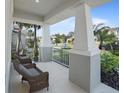Inviting front porch featuring comfortable seating and picturesque neighborhood views at 10464 Tranquil Meadow Loop, Riverview, FL 33569
