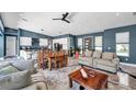 Open-concept living room with kitchen and dining area, perfect for entertaining at 10722 Sumner Rd, Wimauma, FL 33598