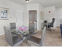 Dining room with a glass table and seating for four at 10764 70Th Ave # 3206, Seminole, FL 33772
