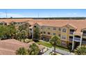 Beautiful condo building with a red tile roof and lush landscaping at 10764 70Th Ave # 3206, Seminole, FL 33772