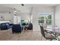 Bright living room with neutral colors and a view of the community at 10764 70Th Ave # 3206, Seminole, FL 33772