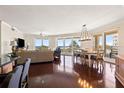 Expansive living and dining room features hardwood floors and stunning ocean views from large windows at 1180 Gulf Blvd # 402, Clearwater Beach, FL 33767