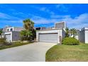Beautiful townhome with an attached garage, landscaped yard, and a well maintained driveway at 13635 Twin Lakes Ln # 13635, Tampa, FL 33618