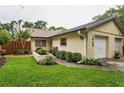 Charming single Gathering home with manicured landscaping and a one car garage at 1948 Elaine Dr, Clearwater, FL 33760