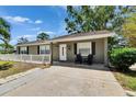 Charming single-story home with front yard, well-maintained lawn, and mature trees at 206 4Th Nw Ave, Ruskin, FL 33570