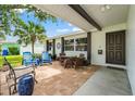 Comfortable front porch, with shade, chairs and table, great for relaxing and enjoying the view at 2334 Tropical Shores Se Dr, St Petersburg, FL 33705