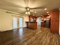 Warm kitchen with wood cabinets, a breakfast bar, and stainless steel appliances at 3419 Pearson Rd, Valrico, FL 33596