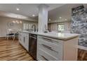 Bright kitchen featuring a center island with white cabinets and stainless steel appliances at 36750 Us 19 N # 24-213, Palm Harbor, FL 34684