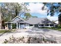 Inviting two-story home with manicured lawn, and fresh landscaping at 4202 Deepwater Ln, Tampa, FL 33615