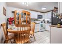 Kitchen area, showing appliances next to dining area and wooden table with chairs at 4527 W Minnehaha St, Tampa, FL 33614