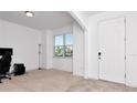 Bright office with neutral carpet, window views, and a convenient doorway for easy access at 5446 Suncatcher Dr, Wesley Chapel, FL 33545