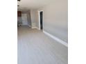 Bright living room features tile floors and fresh paint, creating a modern and airy space at 6345 Lambert Ln, New Port Richey, FL 34652