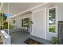 Inviting front porch with a decorative security door, house number, and a 'Welcome' sign at 6618 12Th N St, St Petersburg, FL 33702