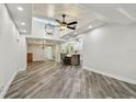 Bright and airy living room featuring vaulted ceilings, wood floors, and an open floor plan at 816 9Th Sw Ave, Largo, FL 33770