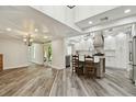 Open concept living space flows into an updated kitchen with stainless appliances and an island at 816 9Th Sw Ave, Largo, FL 33770