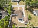 Expansive aerial view of a fenced backyard with a detached garage and ample green space at 914 E North St, Tampa, FL 33604
