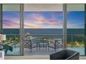 Balcony with seating offers stunning waterfront views and beautiful sunset at 100 1St N Ave # 2703, St Petersburg, FL 33701