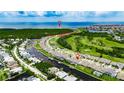 Aerial view of neighborhood with waterfront homes, easy access to the ocean, and golf course at 1028 Signet Dr, Apollo Beach, FL 33572
