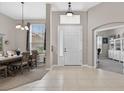 Spacious front foyer with tile floors, adjacent dining room, and direct access to a home office at 111 Falling Water Dr, Brandon, FL 33511