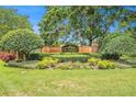 Entrance to the Countryway neighborhood with brick pillars, lush landscaping, and decorative community signage at 11222 Clayridge Dr, Tampa, FL 33635