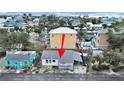 Aerial view of the property, showcasing its proximity to neighboring homes and nearby community at 131 92Nd Ave, Treasure Island, FL 33706