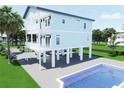 Charming two-story house featuring a private pool and balconies for optimal outdoor enjoyment at 131 92Nd Ave, Treasure Island, FL 33706