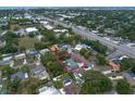Aerial view of home with mature landscaping, conveniently located near major roads and amenities at 13514 Oval W Dr, Largo, FL 33774
