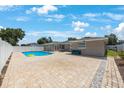 Spacious backyard featuring a refreshing pool and ample patio space, perfect for outdoor relaxation at 1706 Sloop Pl, Brandon, FL 33511