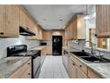 Well-equipped kitchen with granite countertops and ample cabinet space at 1813 Allegheny Dr, Sun City Center, FL 33573