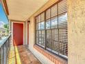 A charming outdoor balcony with tiled floor, overlooking a pleasant view at 21032 Voyager Blvd # 8, Land O Lakes, FL 34638