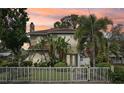Beautiful two-story home with lush tropical landscaping and privacy fence at 2616 11Th N St, St Petersburg, FL 33704