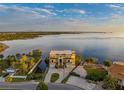 Expansive waterfront property featuring a luxury home with manicured grounds and direct access to the tranquil bay waters at 3236 Gulf Winds Cir, Hernando Beach, FL 34607