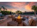 A patio with a gas fire pit and outdoor seating provides a comfortable place to relax at 3691 Center Cir, Largo, FL 33774