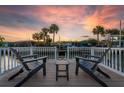 Relaxing dock view with comfortable seating and a picturesque waterfront setting at 3691 Center Cir, Largo, FL 33774